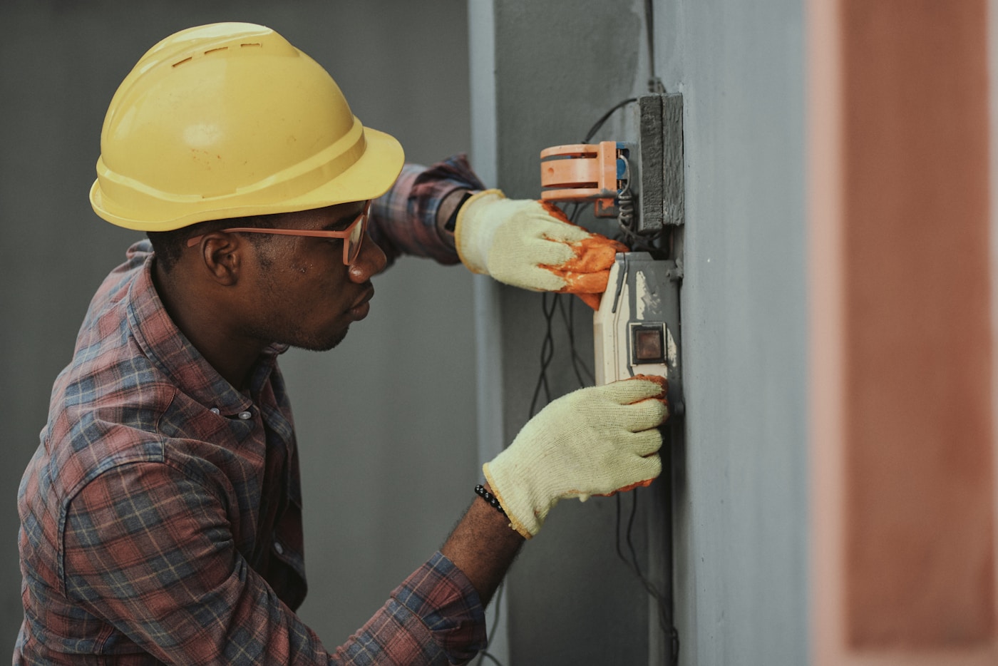 Licensed HVAC technician servicing an air conditioning unit